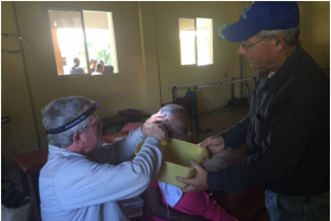 Kurt Chappell removes ear wax prior to fitting 82-year-old fitted with hearing aids